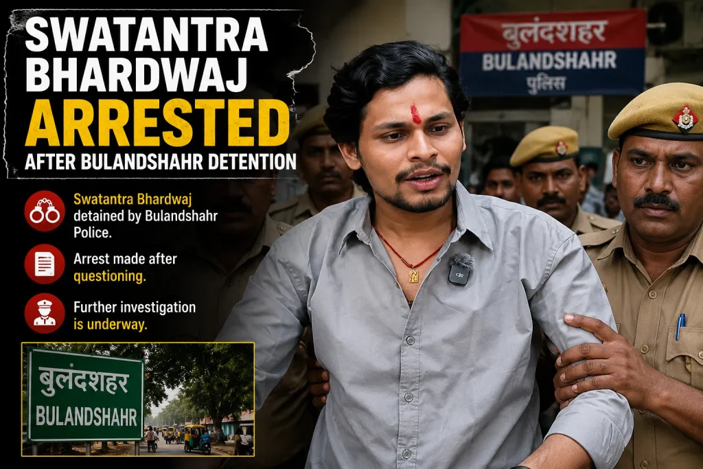 Swatantra Bhardwaj being escorted by Bulandshahr Police after detention, with a Bulandshahr Police station sign in the background.