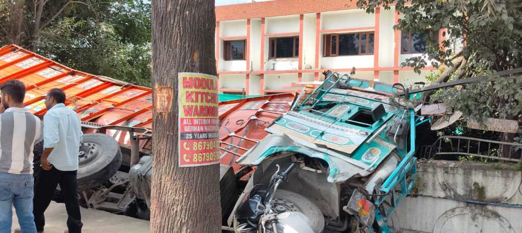 Mohbbewala highway area becomes an accident hotspot; truck loaded with bricks overturns again.